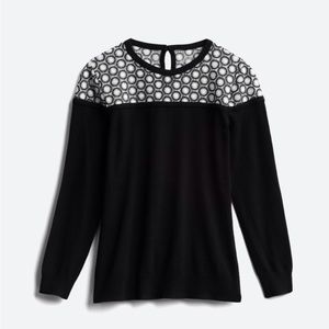 Black and white crochet embroidered sweater.